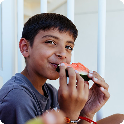 homeslider3 boy eating watermelon
